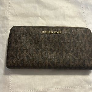 Cute wallet MK with initial pattern.